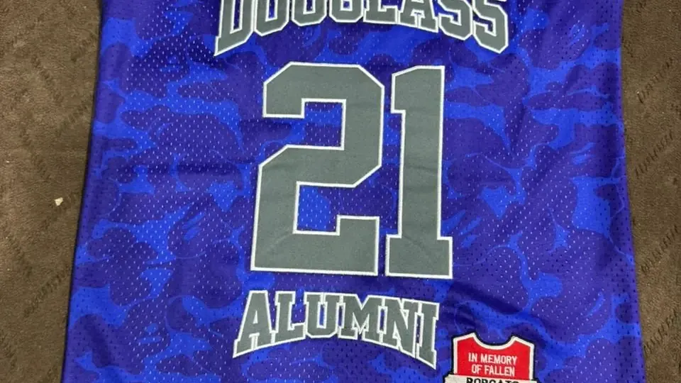 Custom-branded jersey with the client's own wordmark and numbering