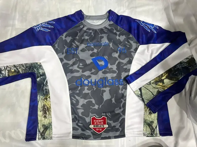 Custom camo long-sleeve crew jersey with embroidered wordmark, front