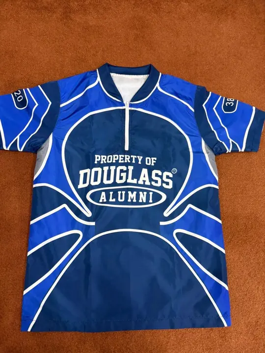 Custom sublimated alumni quarter-zip jersey in royal blue and white, front, flat lay