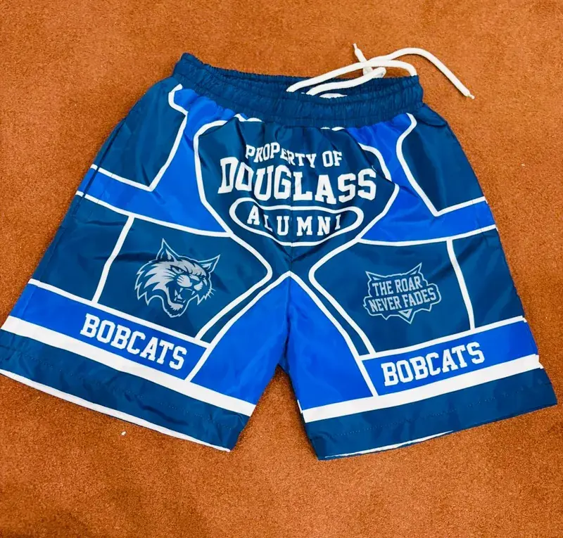 Custom alumni program shorts, flat lay