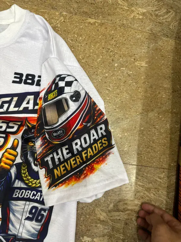 Alumni tribute tee sleeve print detail, helmet graphic