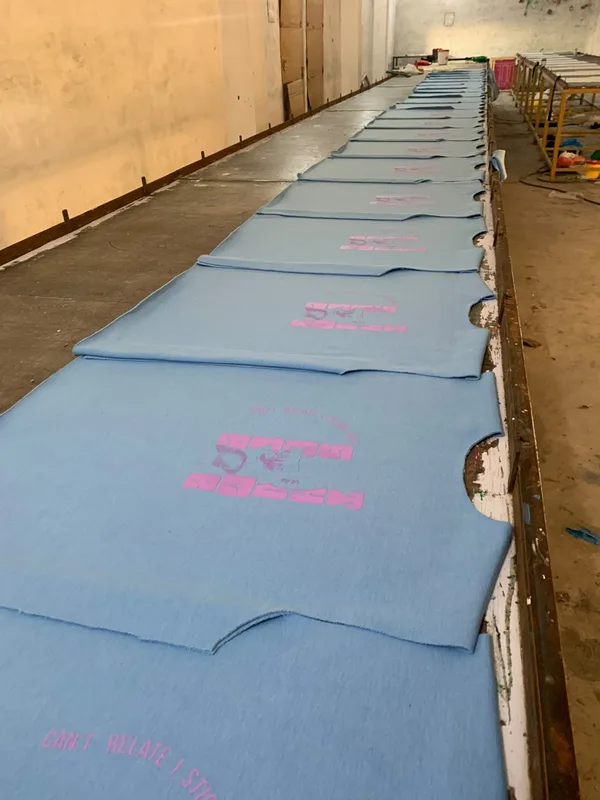 A row of sublimation-printed garment panels before cutting