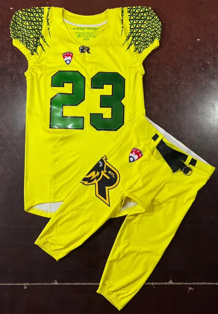 Custom sublimated American football jersey and game pants set, volt yellow with green numbers and geometric sleeve graphic