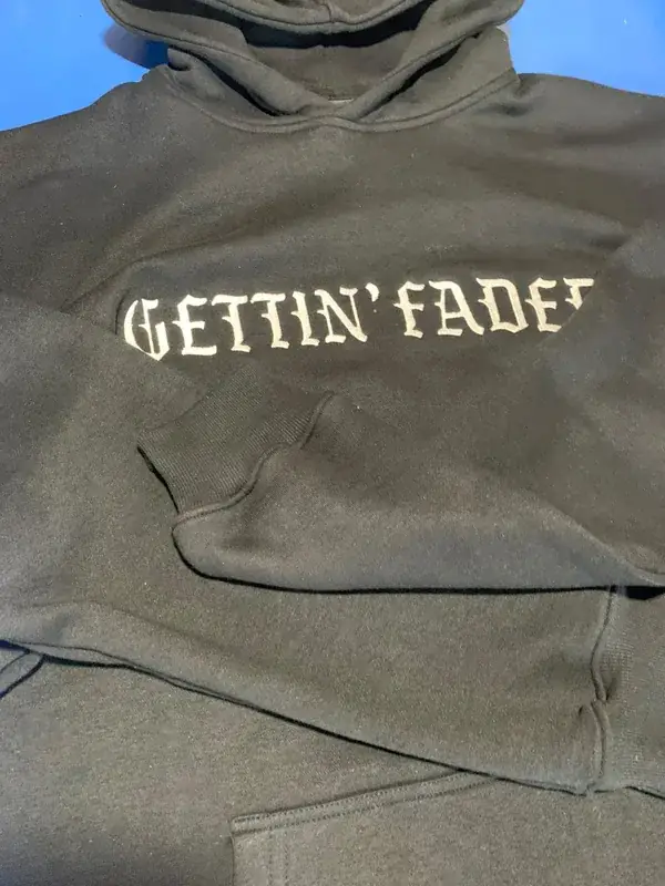 Custom embroidered pullover hoodie, olive colorway, "Gettin' Faded" private-label branding, front