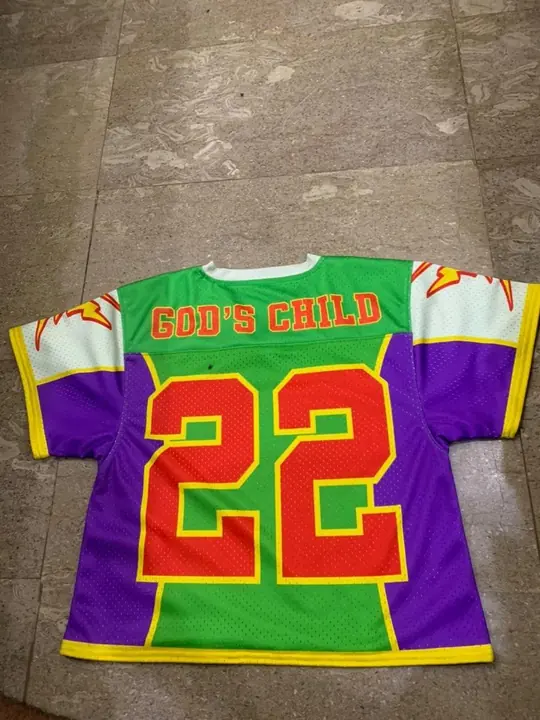Custom sublimated lacrosse jersey with large player number 22, laid flat