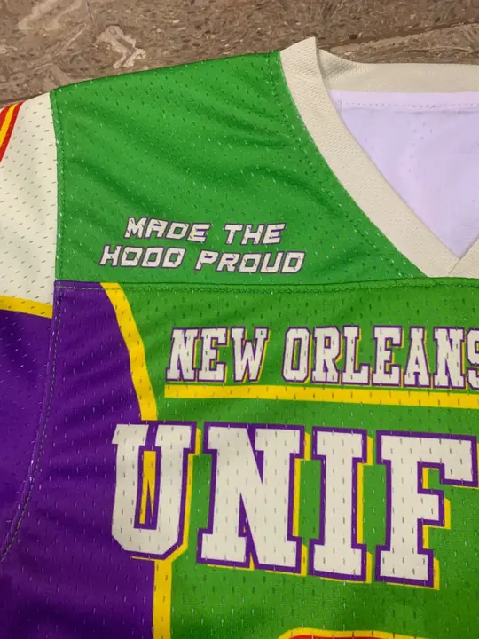 Close-up of a custom sublimated lacrosse jersey chest with printed lettering and colour blocking