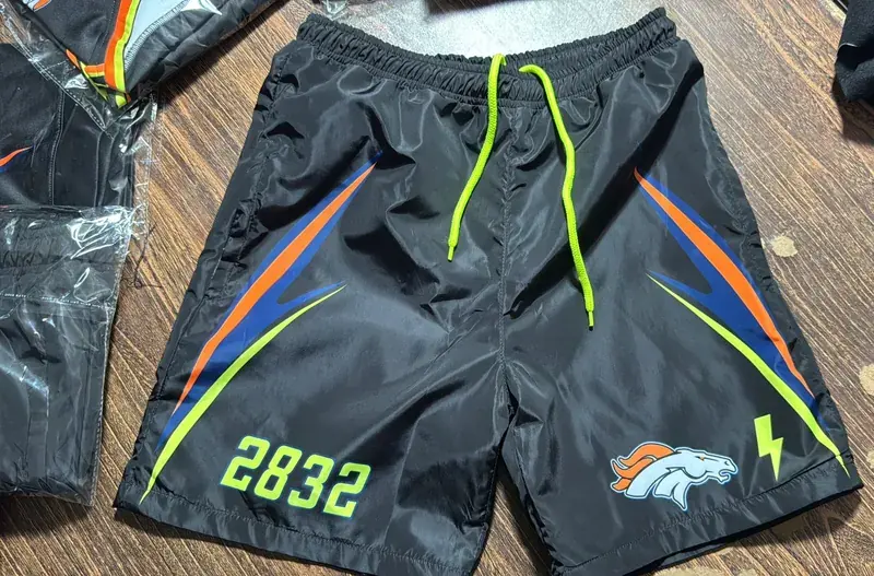 Sublimated jersey hem and branding detail, close-up