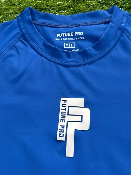 Close-up of a custom printed neck label on a royal blue performance tee