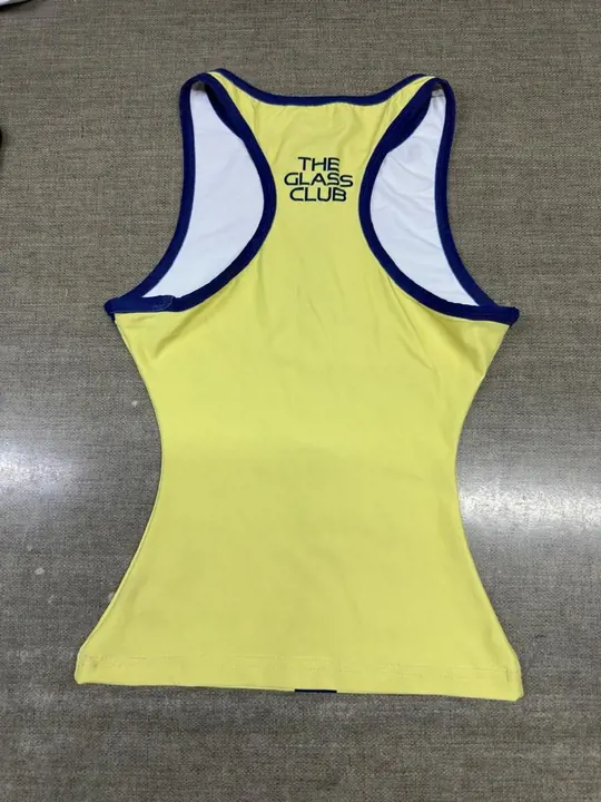 Custom yellow racerback training tank with navy trim and a printed back graphic