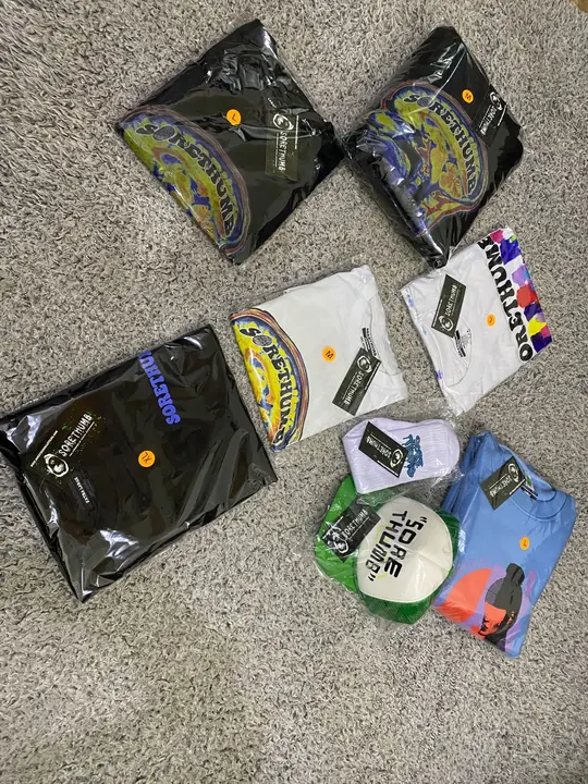 Polybagged garments with printed hang tags and stickers, ready for retail