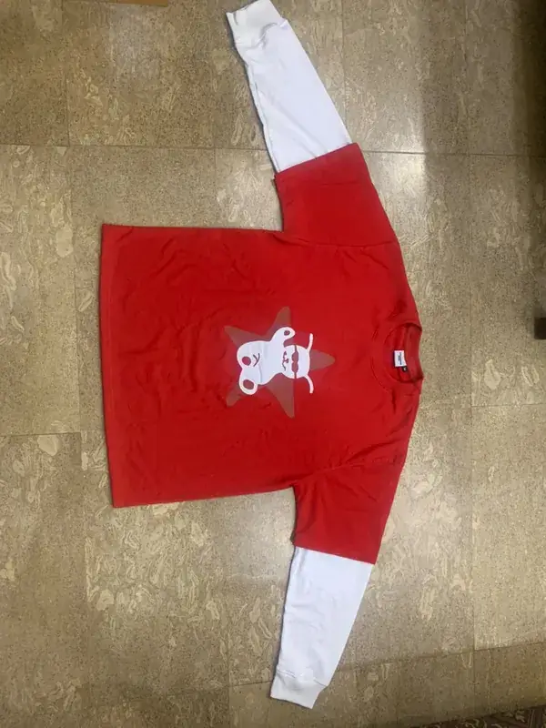 Custom long-sleeve raglan t-shirt, red and white, bear and star graphic print, flat lay