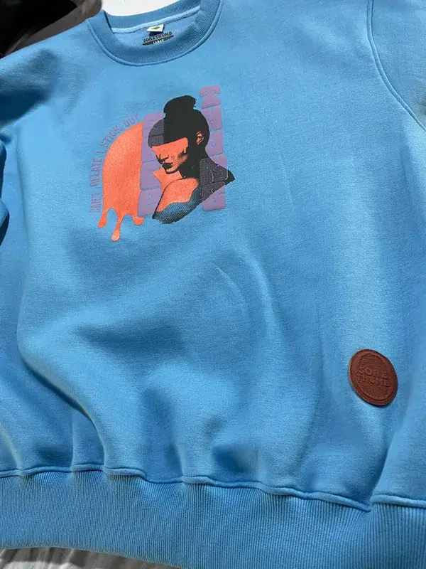 Custom fleece crewneck sweatshirt, light blue colorway, illustrated portrait graphic print