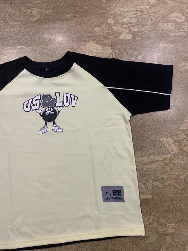 Custom streetwear tee graphic print detail, cream colorway