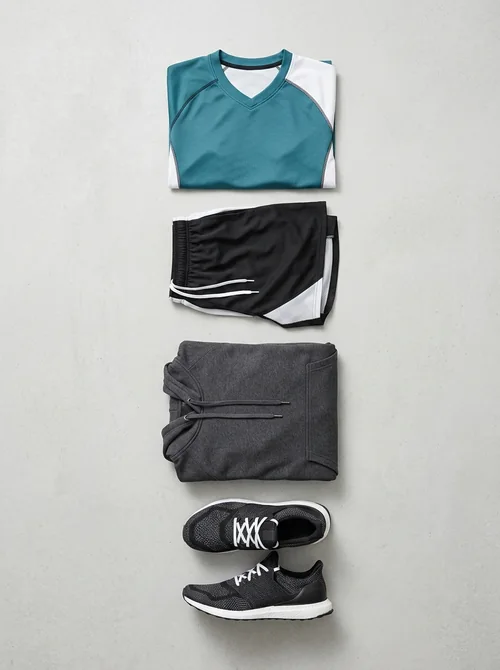Assorted custom sportswear — jersey, shorts, hoodie and running shoes