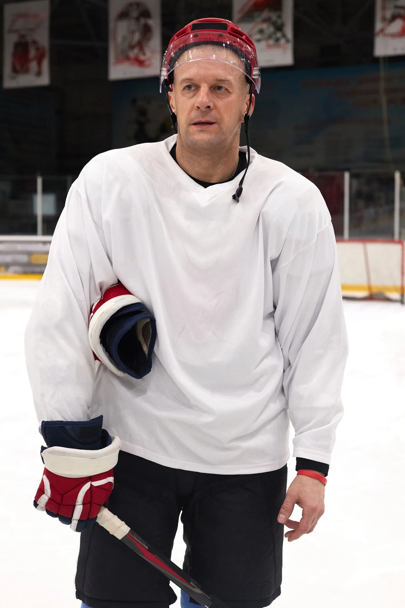 Ice hockey player in custom team jersey and uniform on the rink