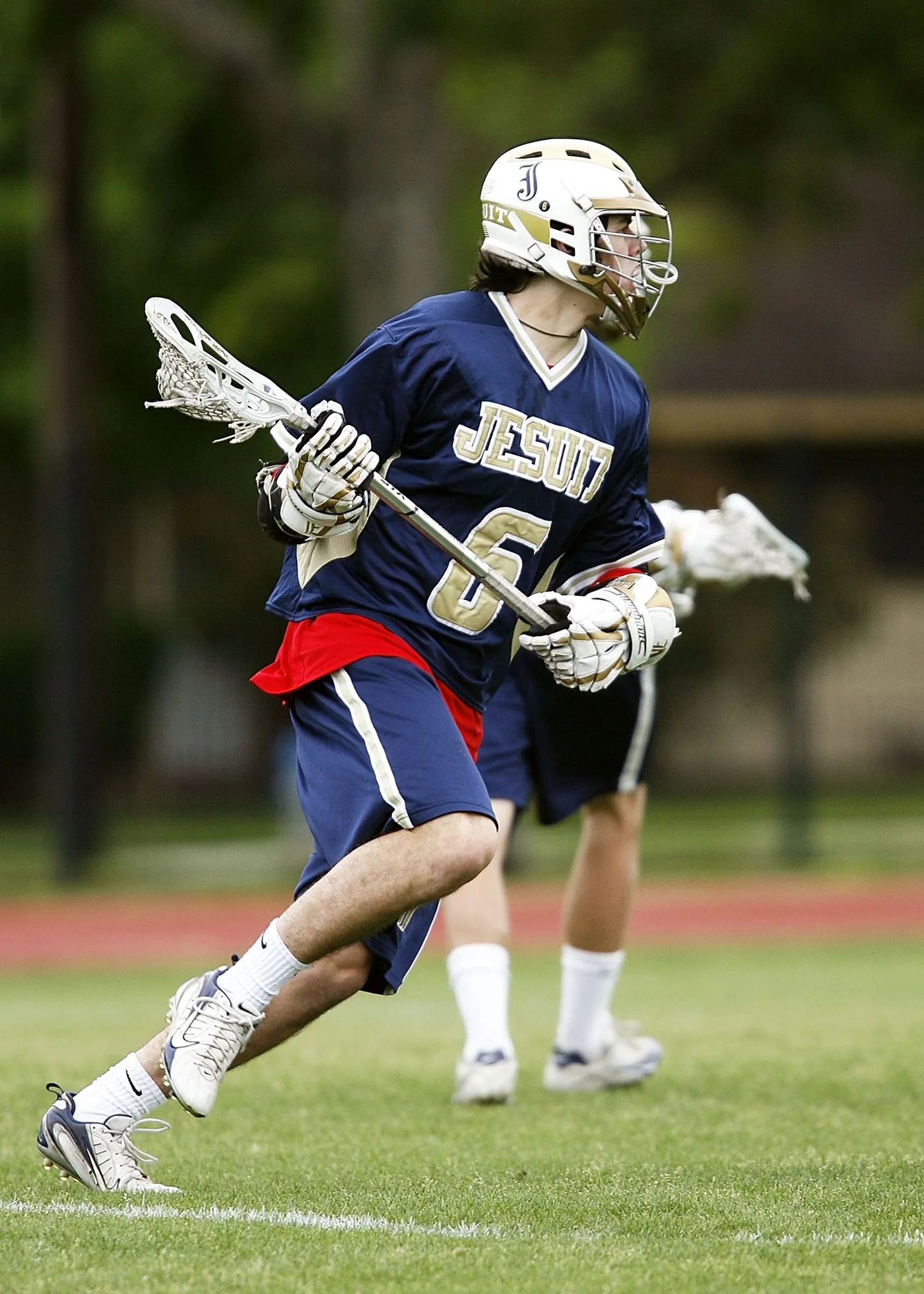 Lacrosse player in a custom team jersey