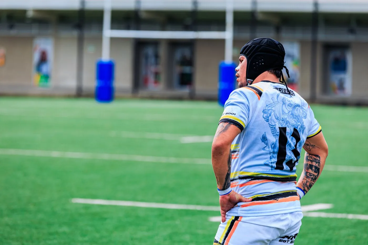 Rugby player in a custom team jersey on the field