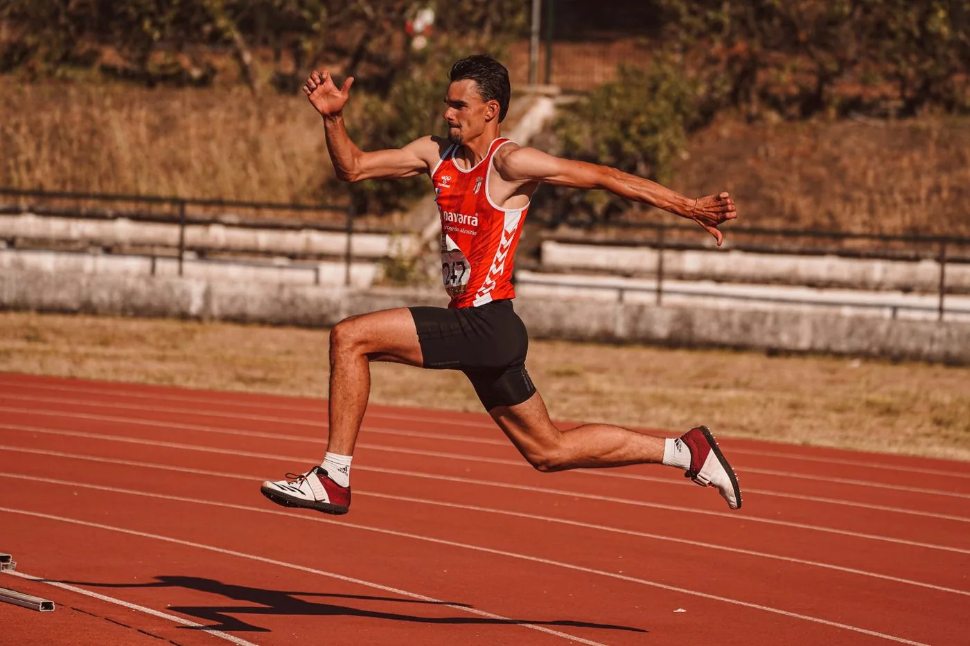 Track and field athlete in a custom racing uniform