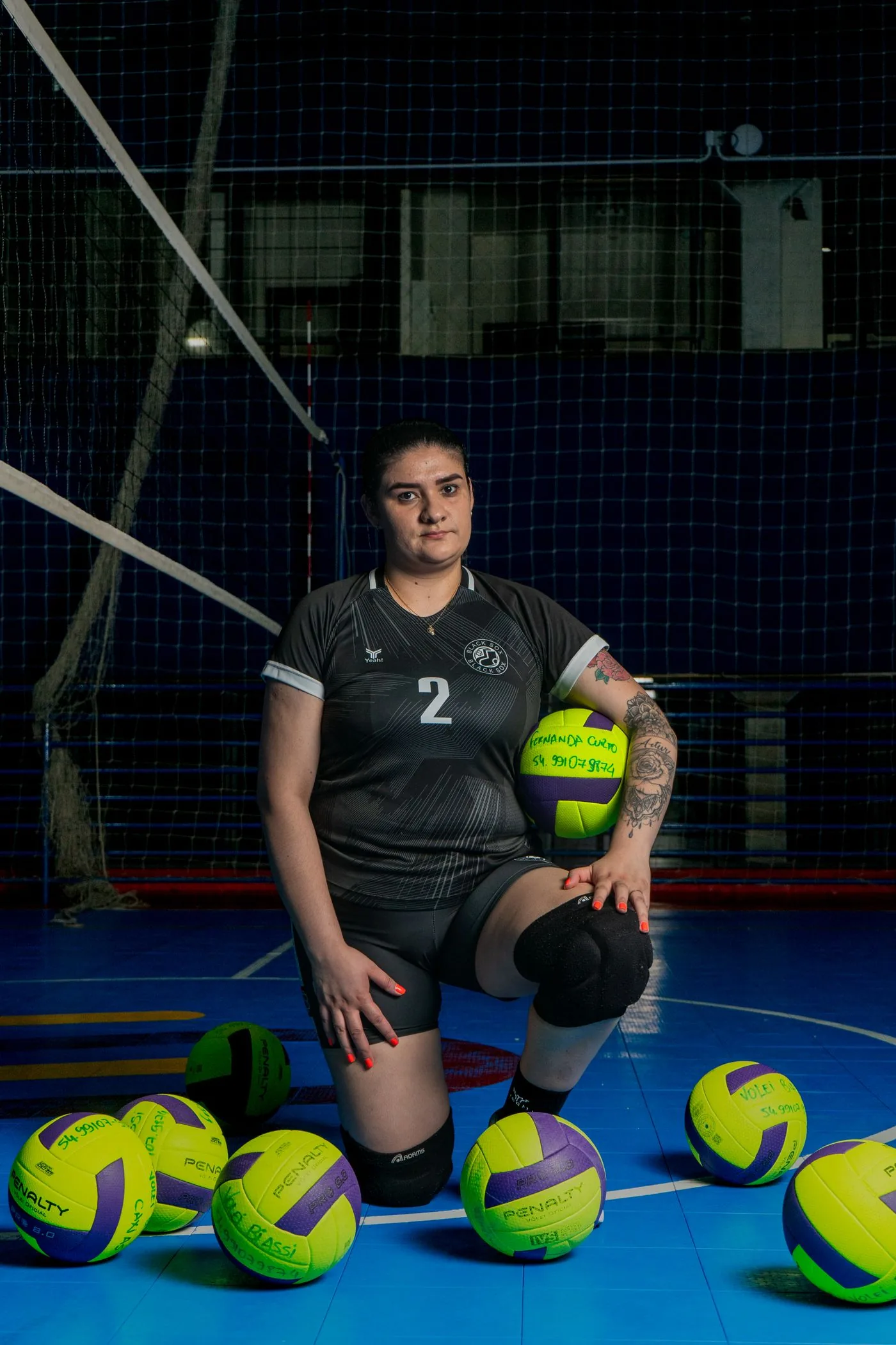 Volleyball player in a custom team jersey on the court